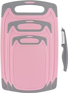 a pink and gray cutting board with two knives