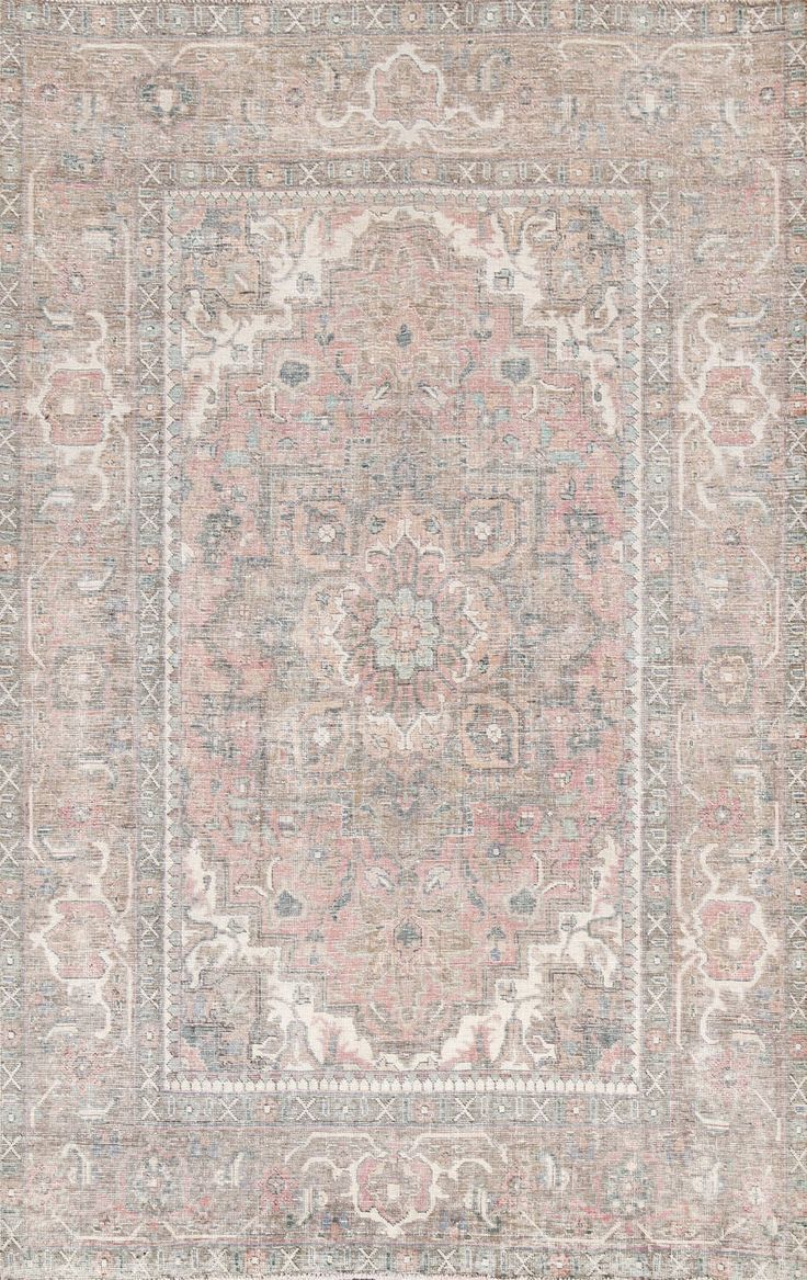 an antique rug with many different colors and patterns on the carpet, including pinks