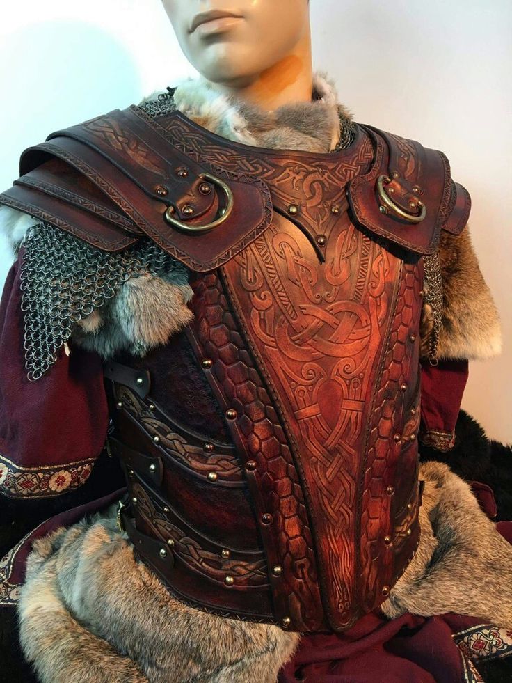 a male mannequin dressed in armor and fur