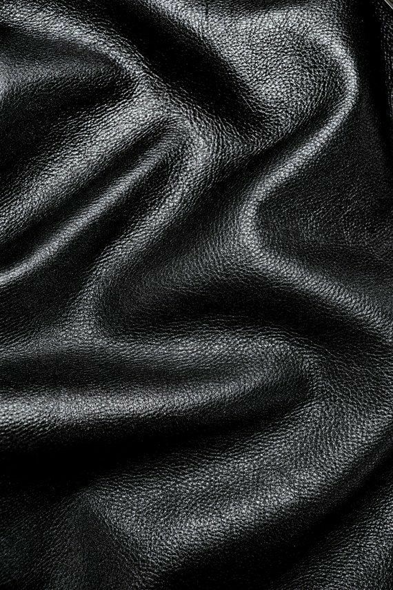 black leather textured up close to the surface