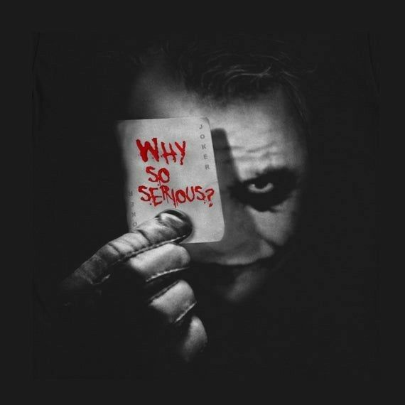 the joker holding up a sign that says why so serious?