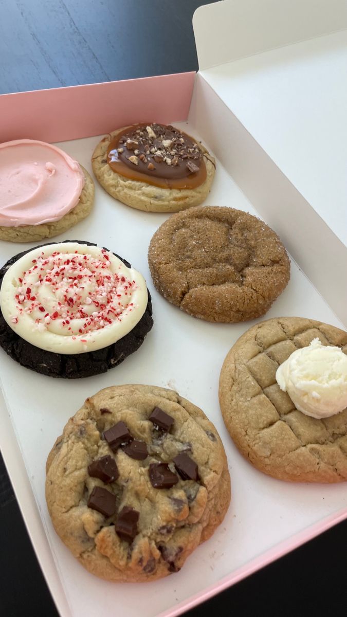 a box filled with different types of cookies