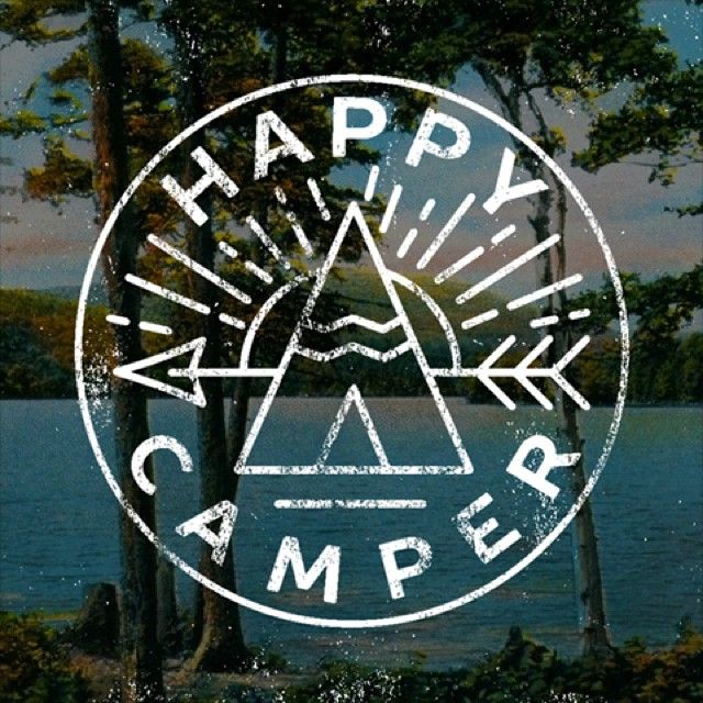 the logo for happy camper is shown in front of some trees and lake water