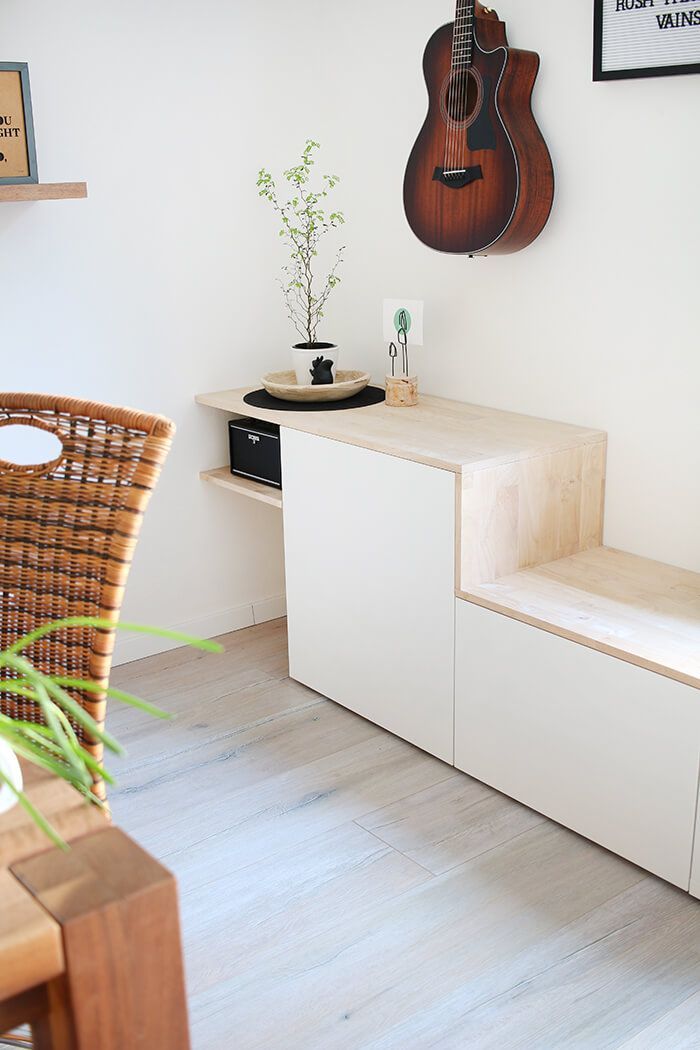 a room with a guitar hanging on the wall