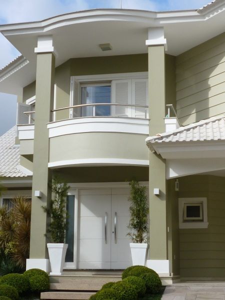 a house that is painted green and white