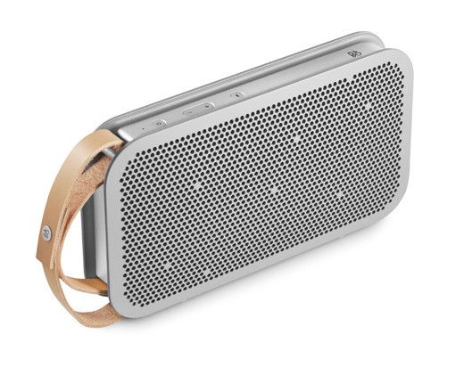 the bluetooth speaker is made out of wood and has a leather strap around it