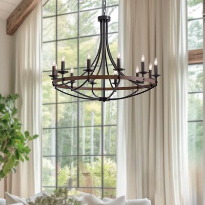 a chandelier hangs from the ceiling in front of a window with drapes