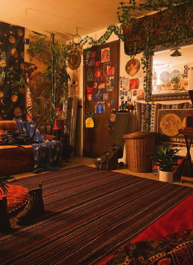 a living room filled with furniture and lots of plants