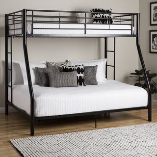 a black metal bunk bed sitting on top of a hard wood floor next to a white rug