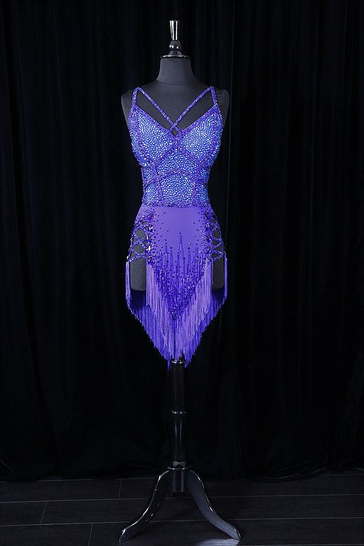 a mannequin with purple sequins on it's torso and back