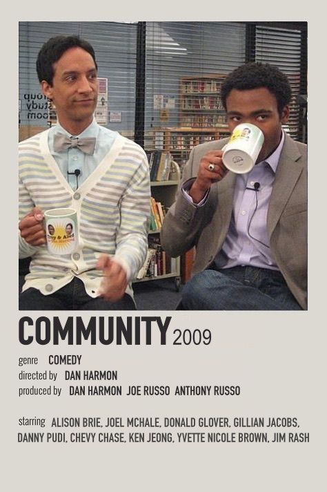 two men sitting next to each other holding coffee mugs in their hands, with the caption community 2009