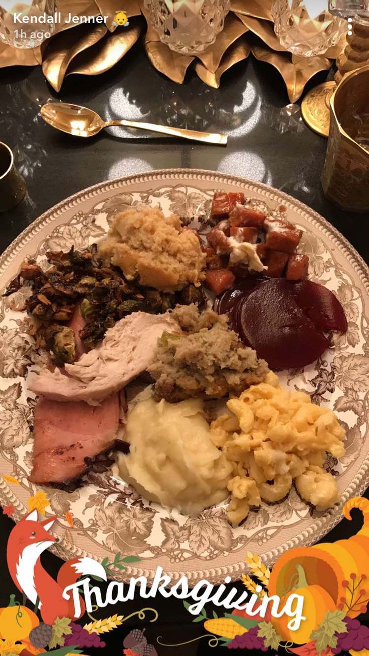 a plate full of thanksgiving food on a table