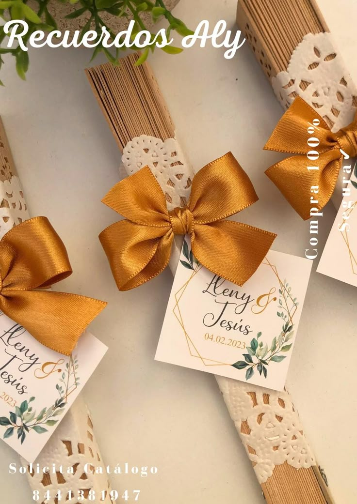 three wedding favors with gold bows and lace