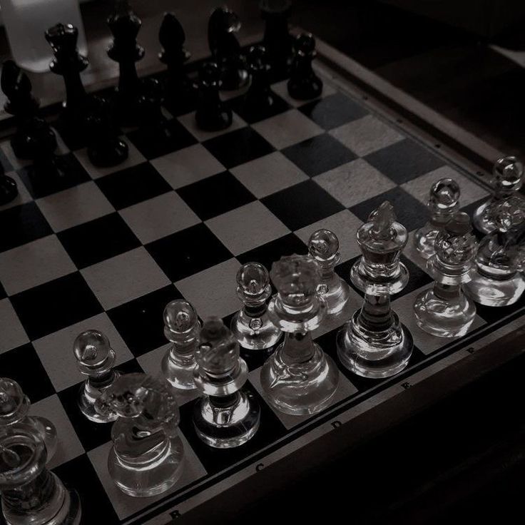 a chess board with glass pieces on it