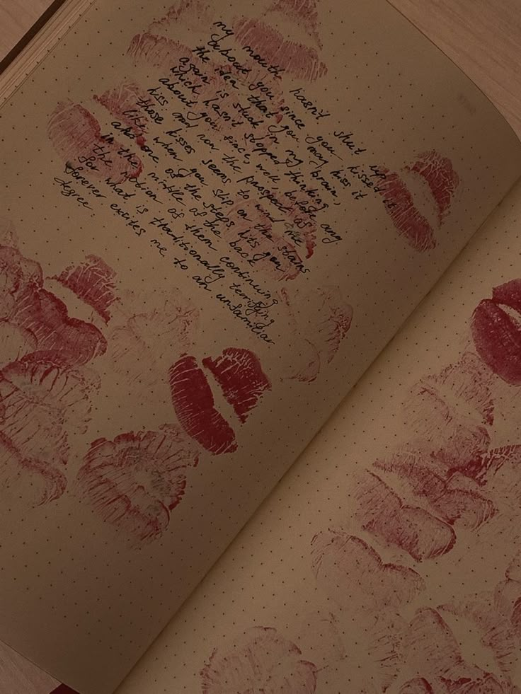 an open book with red ink on it