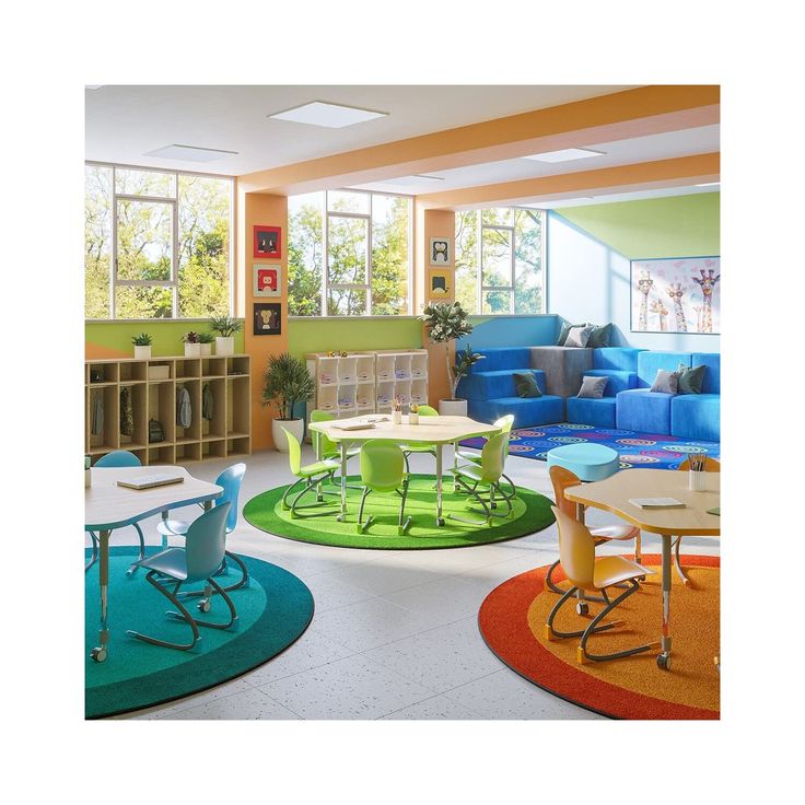 a brightly colored classroom with tables, chairs and bookshelves on the floor in front of large windows