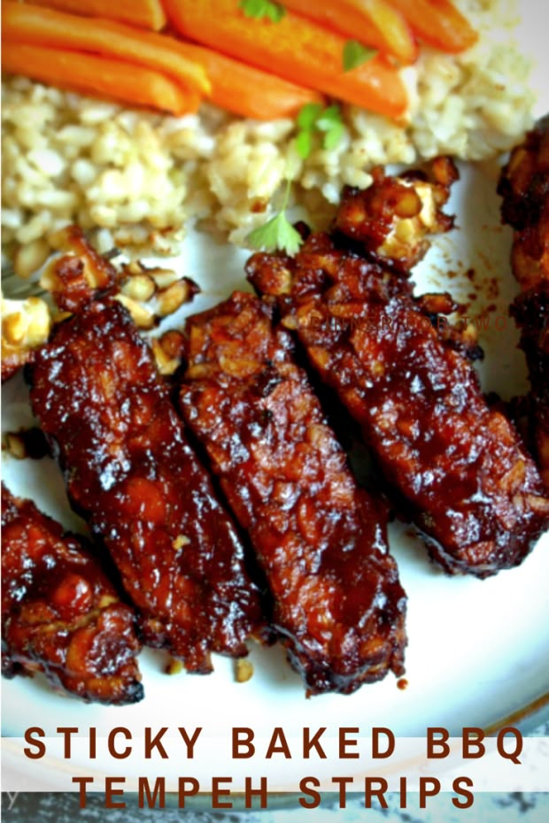 ribs, rice and carrots on a plate with the words sticky baked bbq