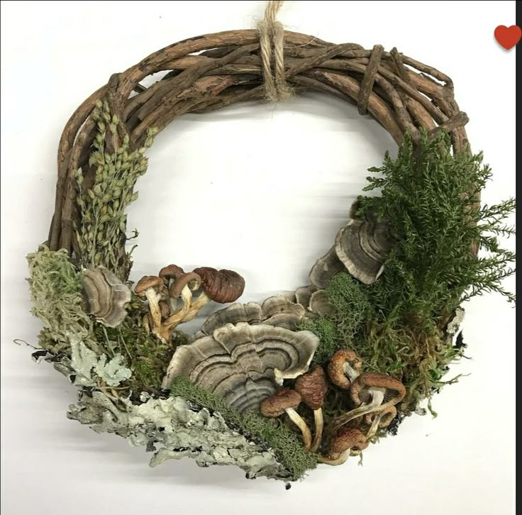 a wreath made out of branches and mushrooms