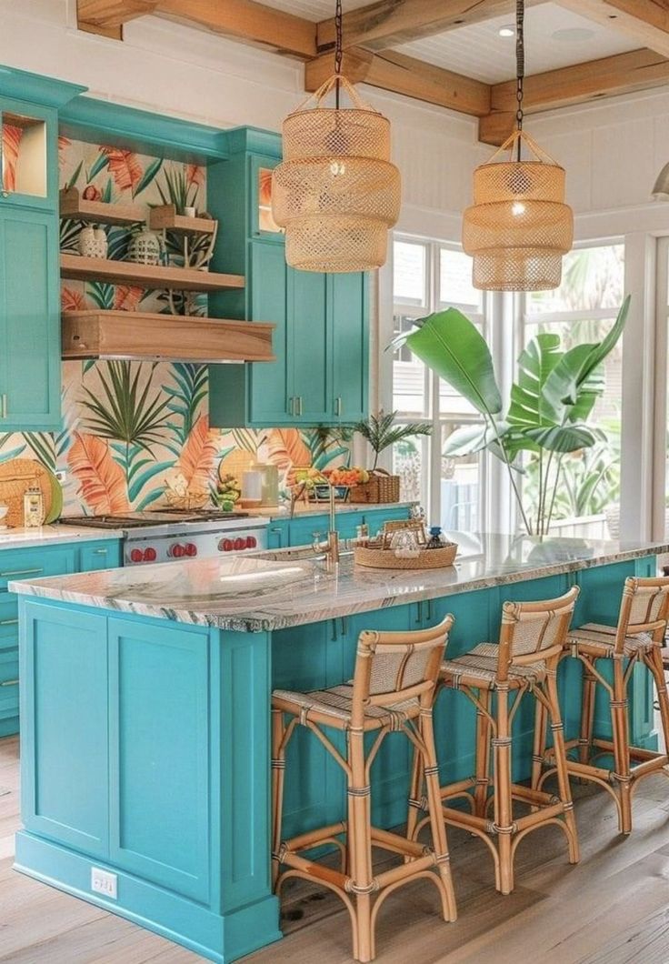 an island in the middle of a kitchen with blue cabinets and stools next to it