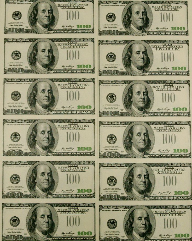 ten hundred dollar bills are arranged in rows