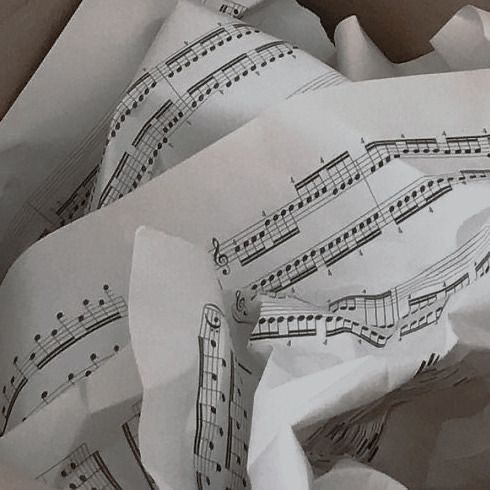 an open box with sheet music on it