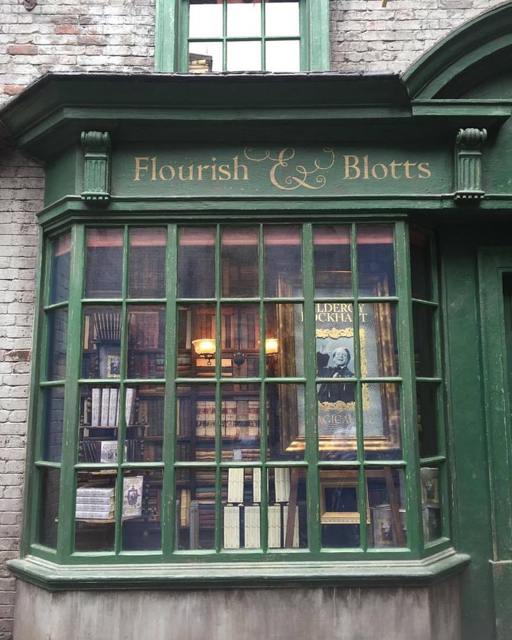 a store front with lots of books in the window