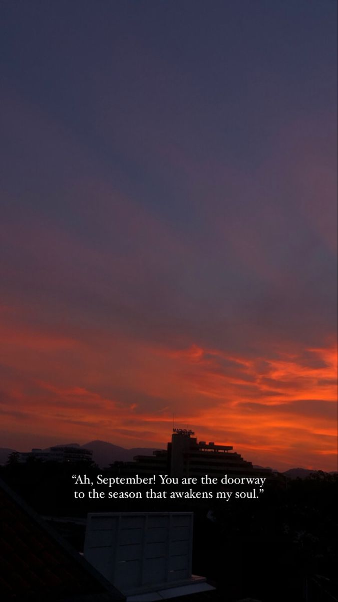 the sun is setting behind some buildings