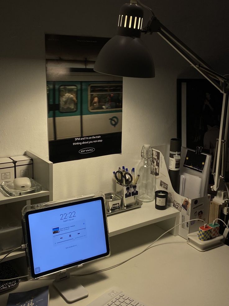 a computer monitor sitting on top of a white desk