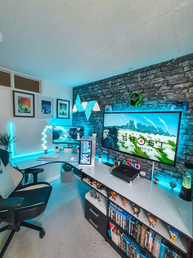 a living room with a large flat screen tv sitting on top of a white table