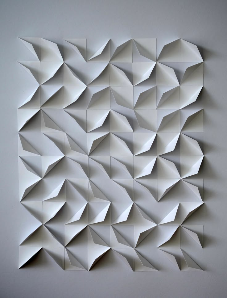 an abstract piece of paper that looks like it is made out of folded origami