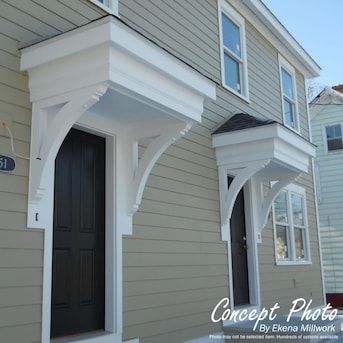 a gray house with white trim and black door