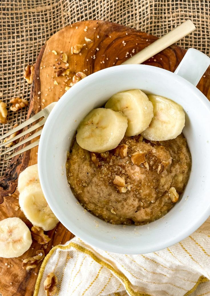 a bowl of oatmeal with bananas and walnuts