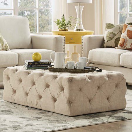 a living room with two couches and a coffee table in front of the window