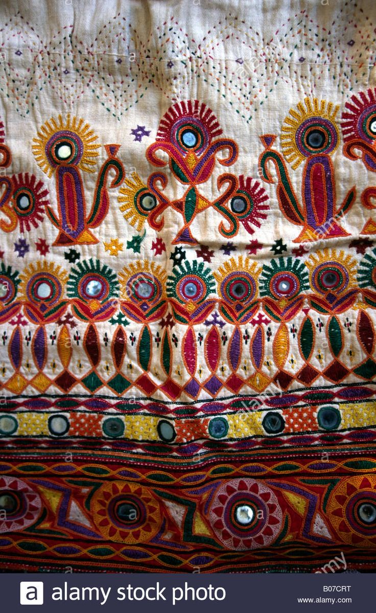 an embroidered cloth with colorful designs on it