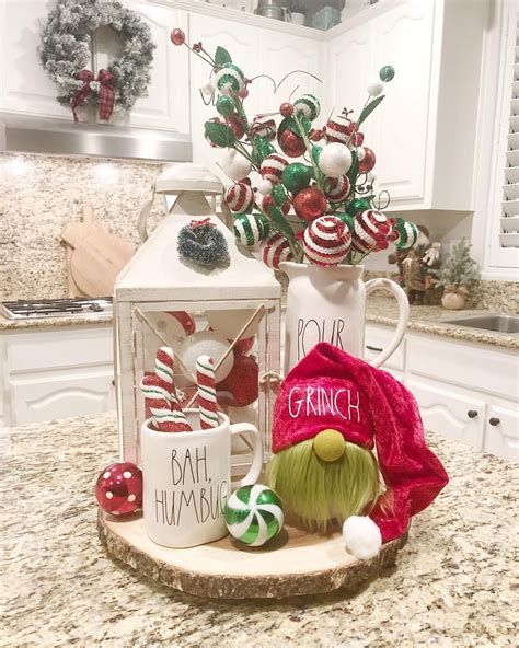 a kitchen counter with christmas decorations on it and a gnome figurine in the center