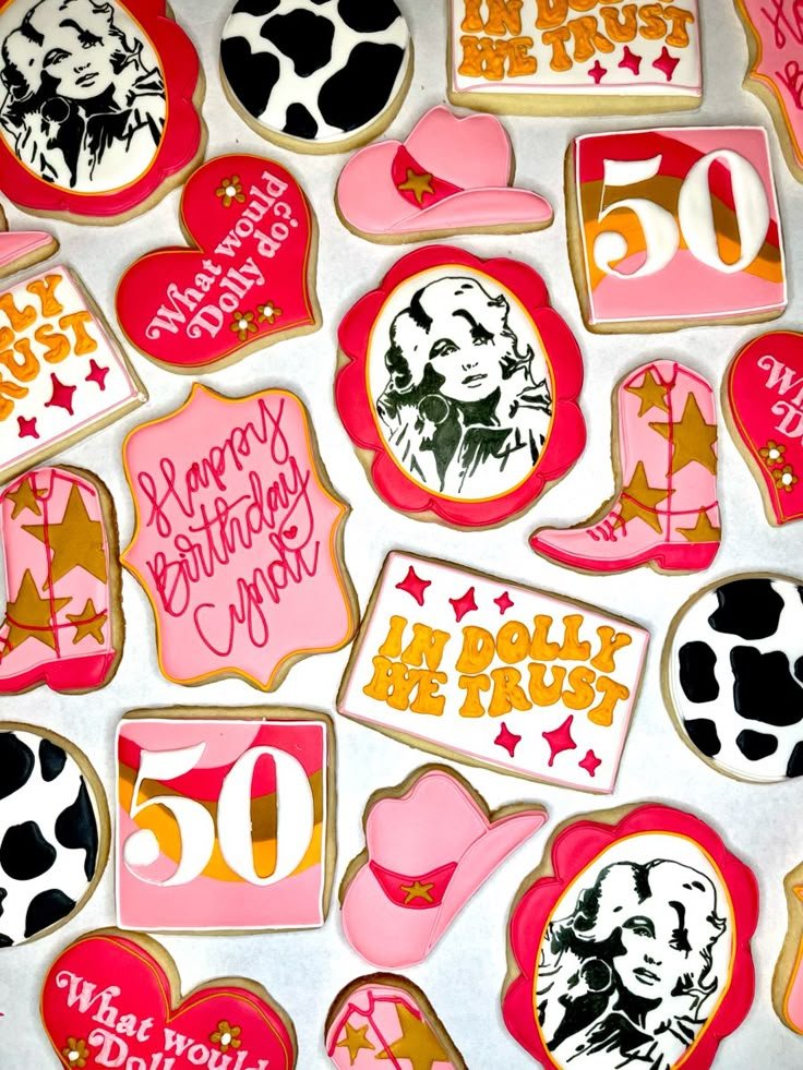 decorated cookies are arranged on a table for someone's 60th birthday party or special occasion