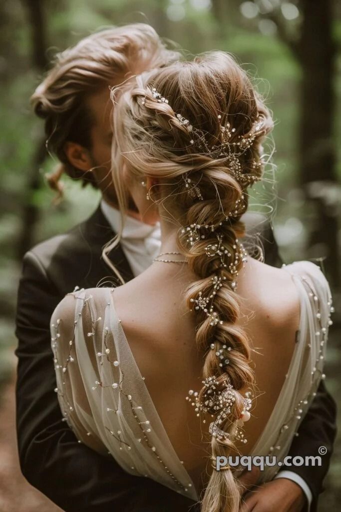 a man and woman are standing in the woods with their backs to each other, wearing braids