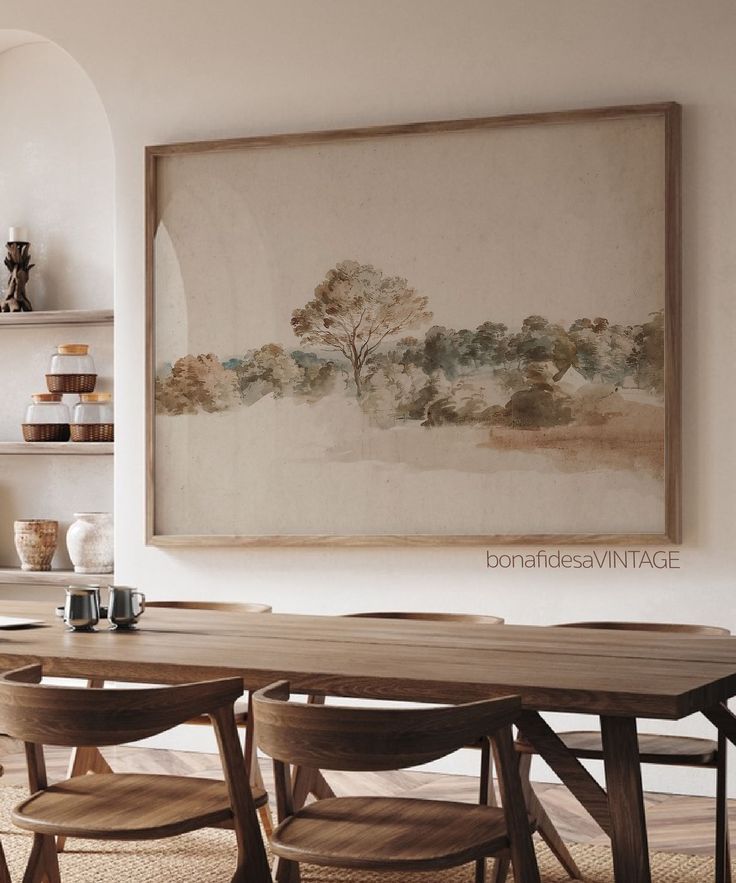 a painting hanging on the wall above a dining room table