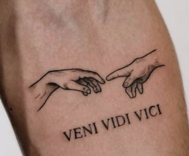 two hands touching each other with the words veni vidi vici on it