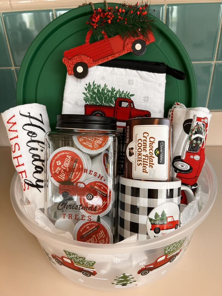 a basket filled with christmas items on top of a counter next to a green plate