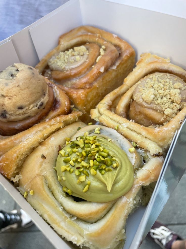 a box filled with different types of pastries