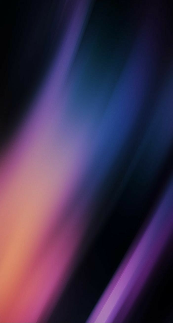 a blurry image of an orange and purple background