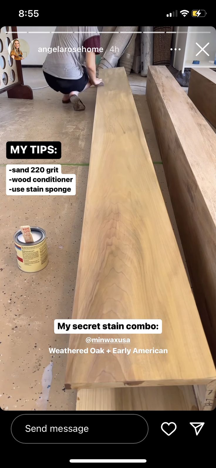 a wooden bench being sanded and painted by someone using the same color as it is