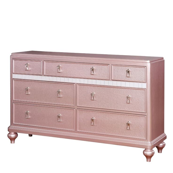 a pink dresser sitting on top of a white floor