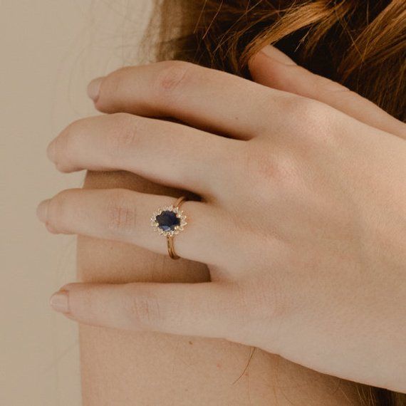 Blue Sapphire Engagement Ring | Oval Halo Ring | Blue Sapphire Ring | Blue Halo Engagement Ring | Bl Dark Blue Stone Ring, Blue Sapphire Engagement Ring Oval, Engagement Ring Oval Halo, Daisy Engagement Ring, Engagement Ring Blue Stone, Blue Sapphire Engagement Ring Halo, Sapphire Engagement Ring Oval, Engagement Vibes, Blue Sapphire Halo Ring