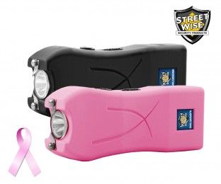 two pink and black flashlights sitting next to each other with a pink ribbon around them