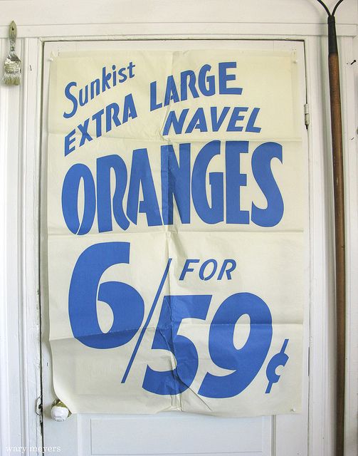 an extra large oranges for $ 59 99 is on the front of this sign