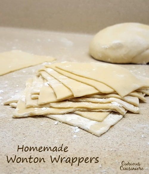 homemade wonton wrappers sitting on top of a counter