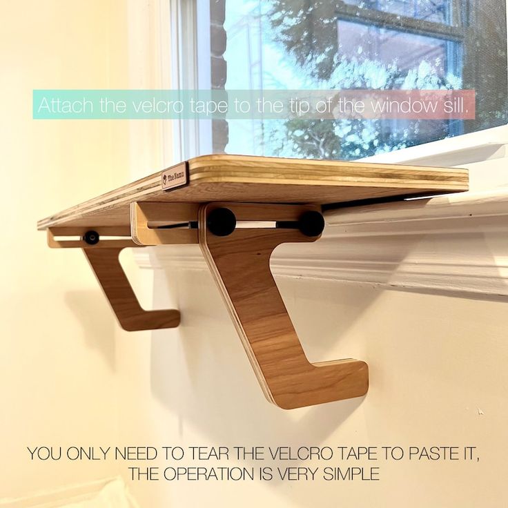 a wooden shelf attached to the side of a window sill with an inspirational quote