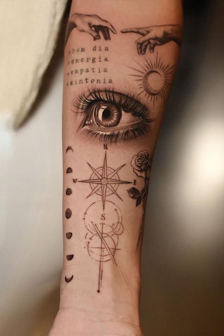 a woman's arm with tattoos on it and an eye in the center, surrounded by other symbols